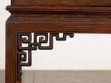a close up of a wooden table with a clock on it