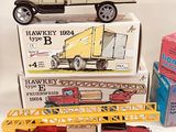 many different types of toy trucks and trucks on the table