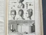 an open book with a drawing of a woman ' s head and a man ' s head