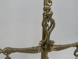 a gold colored chandelier hanging from the ceiling