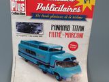 the front cover of a magazine with a blue bus on it