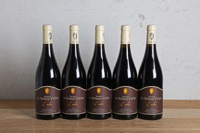six bottles of wine are lined up on a wooden table