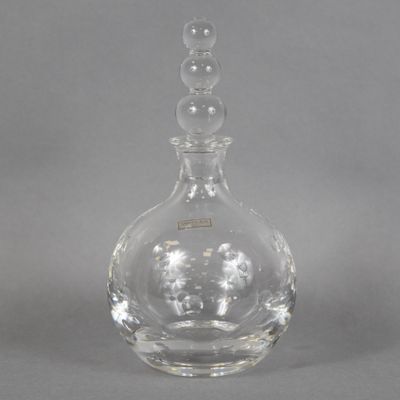 a clear glass bottle with a lot of bubbles on it