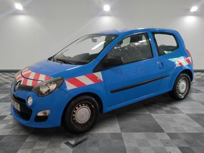 a picture of a small blue car parked in a garage