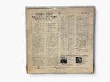 an old newspaper with a picture of a man and a woman on it