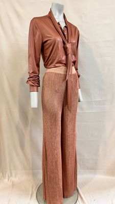 an image of a mannequin wearing a brown shirt and pants