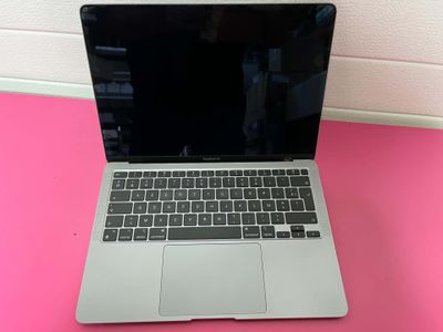 an apple macbook pro laptop is sitting on a pink surface