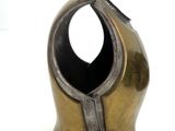 a small metal object with a gold helmet on top of it