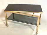 a coffee table with a glass shelf on it