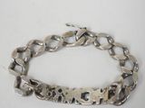 silver plated bracelet with a chain that says love on it