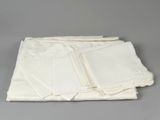 white napkins and napkins on a table with a gray background