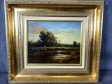 un tableau représentant un paysage avec des arbres et de l'eau, dans un cadre doré