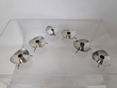 a glass display case with a bunch of silver cups on it