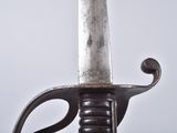 a close up of a sword with a metal handle