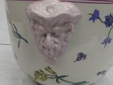 a white bowl with a face on it on a table