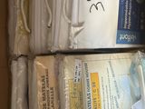 a box full of white towels and other items in it