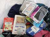 a pile of clothes and other items in a bag