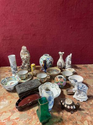 a table with a lot of vases and plates on it