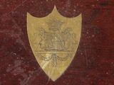 a gold shield with a coat of arms on it