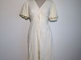 an image of a white dress on a mannequin stand