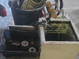 a pile of junk sitting on a pallet in a garage