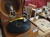 an old record player sitting on top of a table