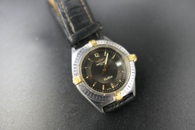 a close up of a watch on a table