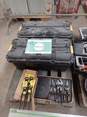 many tools that are sitting on a pallet in the warehouse