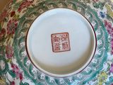 a bowl with a floral design on it sitting on a table