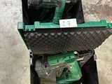 two tools in a case sitting on the floor