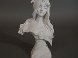 statue of a woman with long hair wearing a white dress