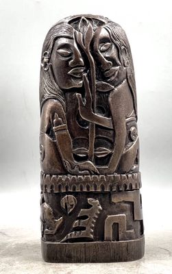an image of a wooden sculpture of a woman and a man