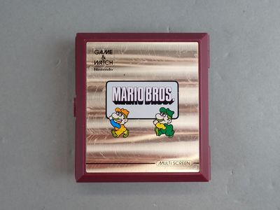 une image représentant un boîtier de jeu Nintendo orné d'un personnage de Mario Bros