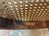 a close up view of a metal chair with holes in it