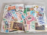 many different stamps in a plastic bag on the table