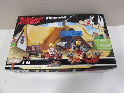 the box is open to show the contents of a playmobil set
