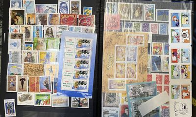 many different stamps on the back of a black case