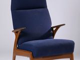 an image of a blue chair with a wooden frame and armrest