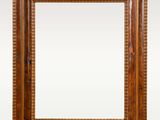 an antique wooden frame with a beaded edge on a white background