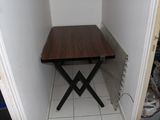 a small table that is in the corner of a room