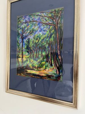 tableau encadré représentant une scène forestière avec des arbres au premier plan