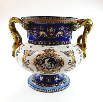 a blue and white vase sitting on a white surface