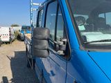 a blue van parked on the side of the road