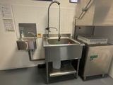 a kitchen with a sink and a dishwasher in it