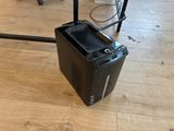 a computer sitting on the floor in the middle of the room