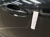 a sticker on the door handle of a car