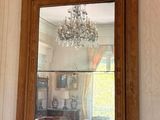 a mirror hanging on the wall of a living room