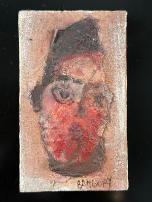 une photo d'un tableau représentant le visage d'un homme