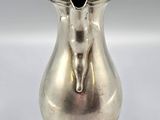 a silver vase with a lid on a white background