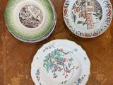 three plates on a table with a wooden table top